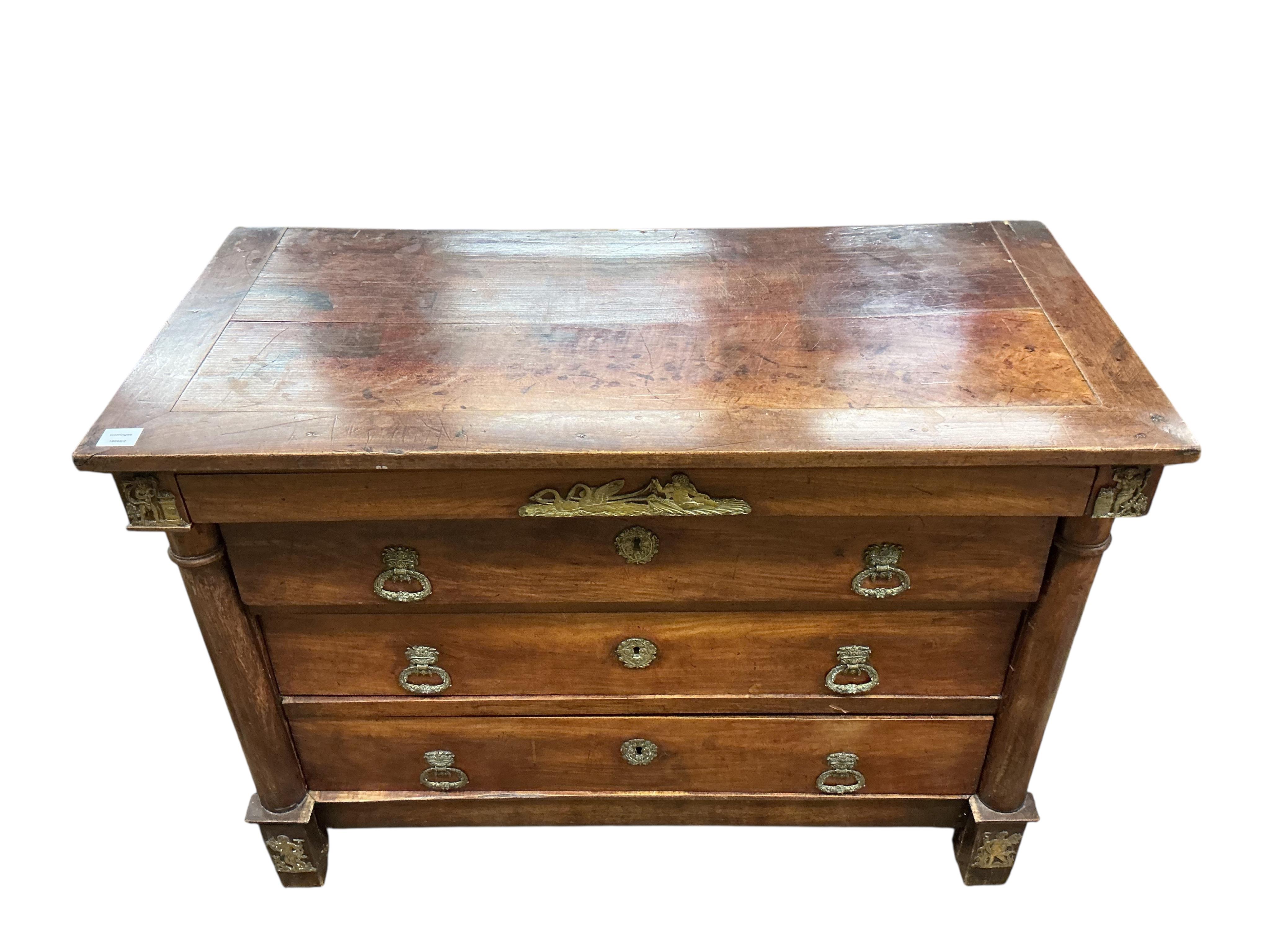 An early 19th century French ormolu mounted cherry commode, fitted four long drawers, width 117cm, depth 56cm, height 87cm